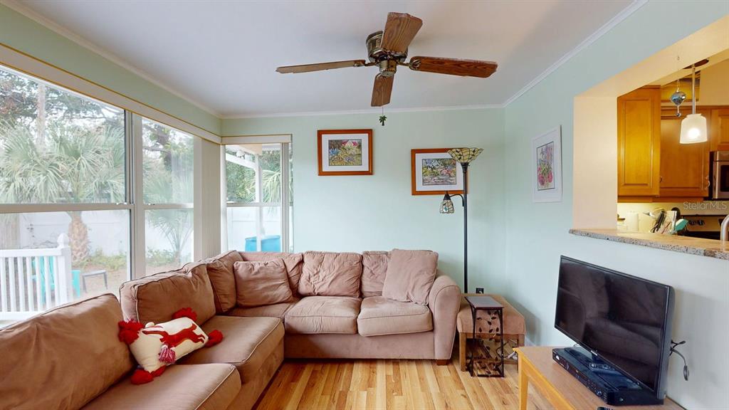 1618 Tuscola Road Clearwater, FL 33756 - Photo 47 of 64 a living room with furniture and a flat screen tv