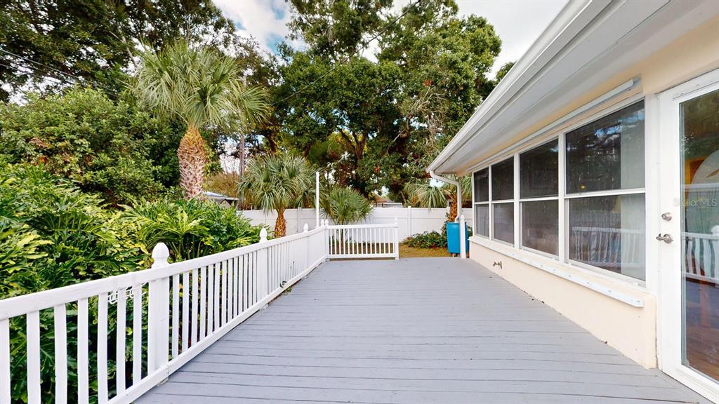 1618 Tuscola Road Clearwater, FL 33756 - Photo 60 of 64 a view of balcony with a large window and wooden fence
