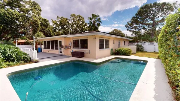 a bedroom with furniture and a book shelf