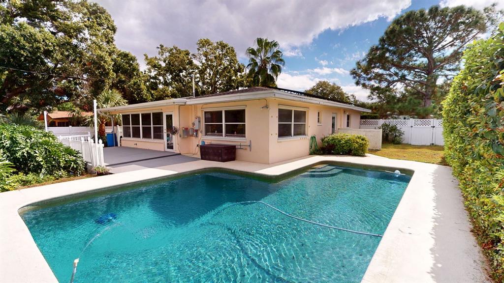 1618 Tuscola Road Clearwater, FL 33756 - Photo 7 of 64 a view of a house with pool yard and trees