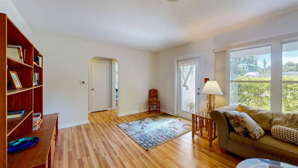 1618 Tuscola Road Clearwater, FL 33756 - Photo 10 of 64 a bedroom with furniture and a book shelf