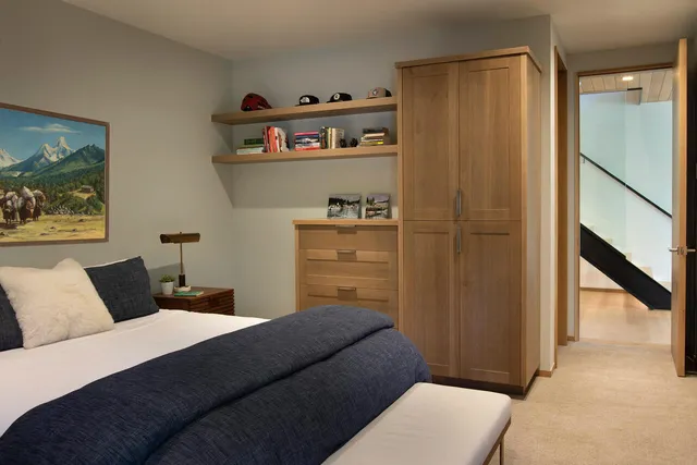 a bedroom with a bed and a cabinets