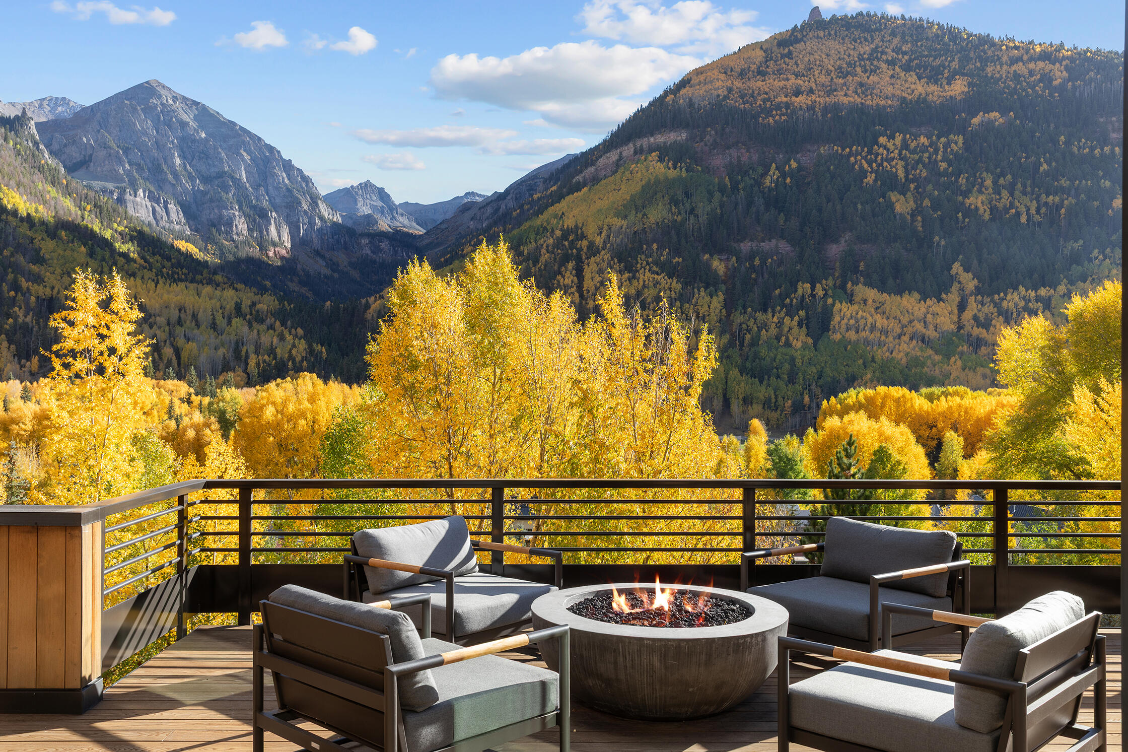 653 East Pandora Avenue Telluride, CO 81435 - Photo 2 of 35 a view of a balcony with two chairs and a potted plant
