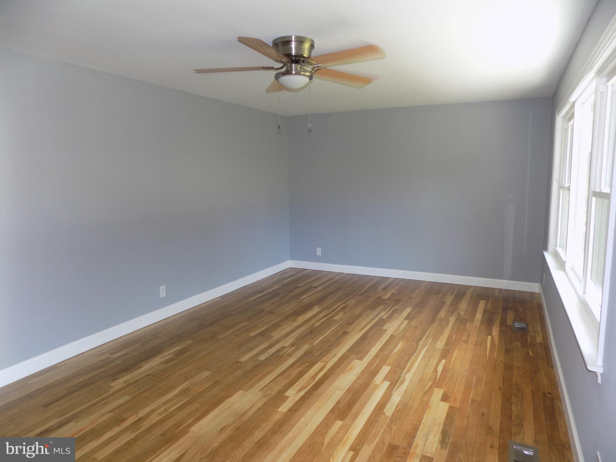 620 Romancoke Road Stevensville, MD 21666 - Photo 21 of 47 Gleaming hardwoods in living room.