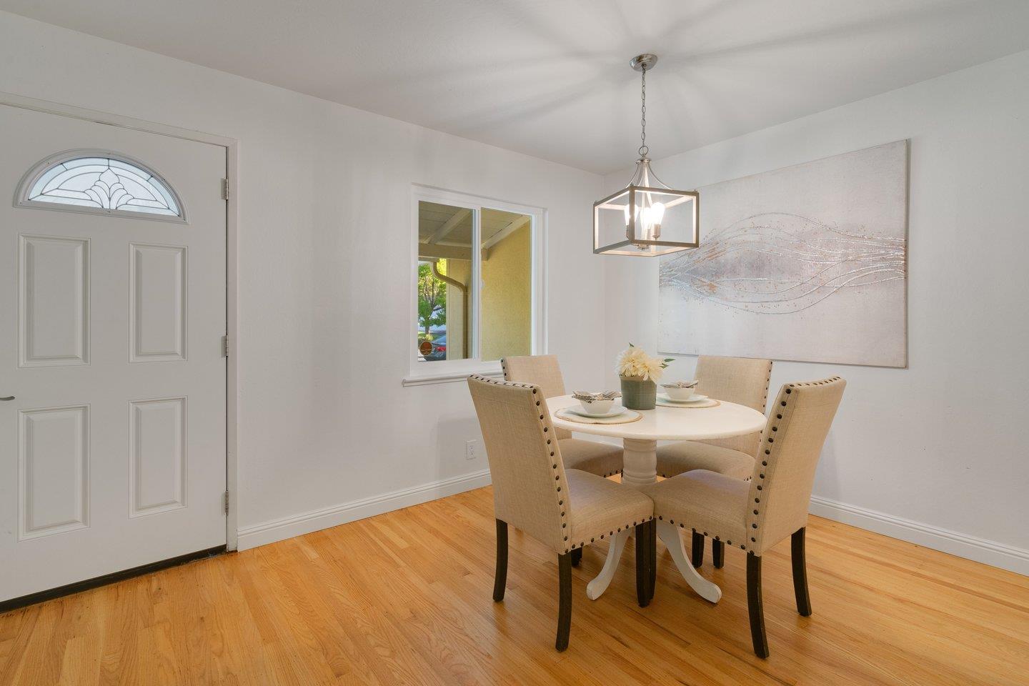 7457 Rollingdell Drive Cupertino, CA 95014 - Photo 11 of 33 a view of a dining room with furniture window and wooden floor