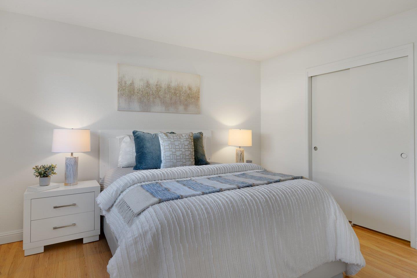 7457 Rollingdell Drive Cupertino, CA 95014 - Photo 17 of 33 a bedroom with a bed and a night stand