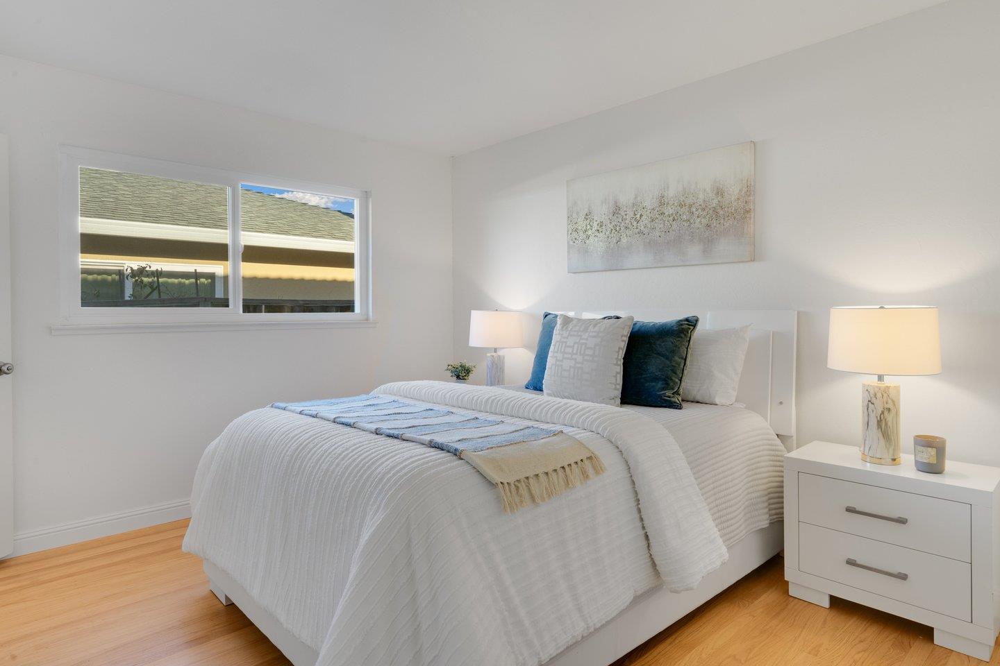 7457 Rollingdell Drive Cupertino, CA 95014 - Photo 18 of 33 a bedroom with a bed and a window