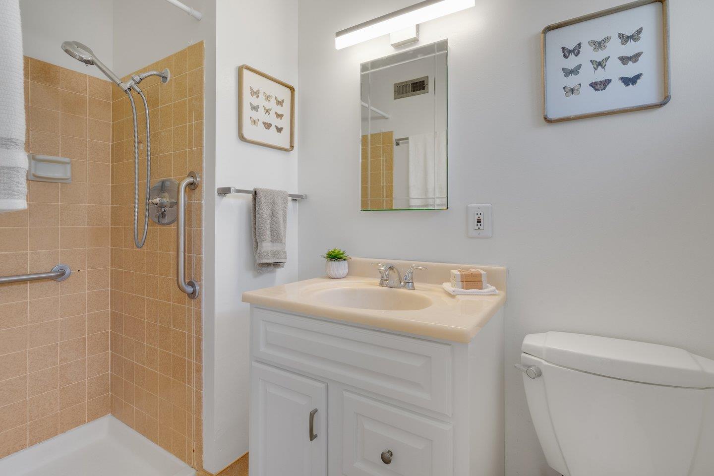 7457 Rollingdell Drive Cupertino, CA 95014 - Photo 19 of 33 a bathroom with a sink toilet and a mirror