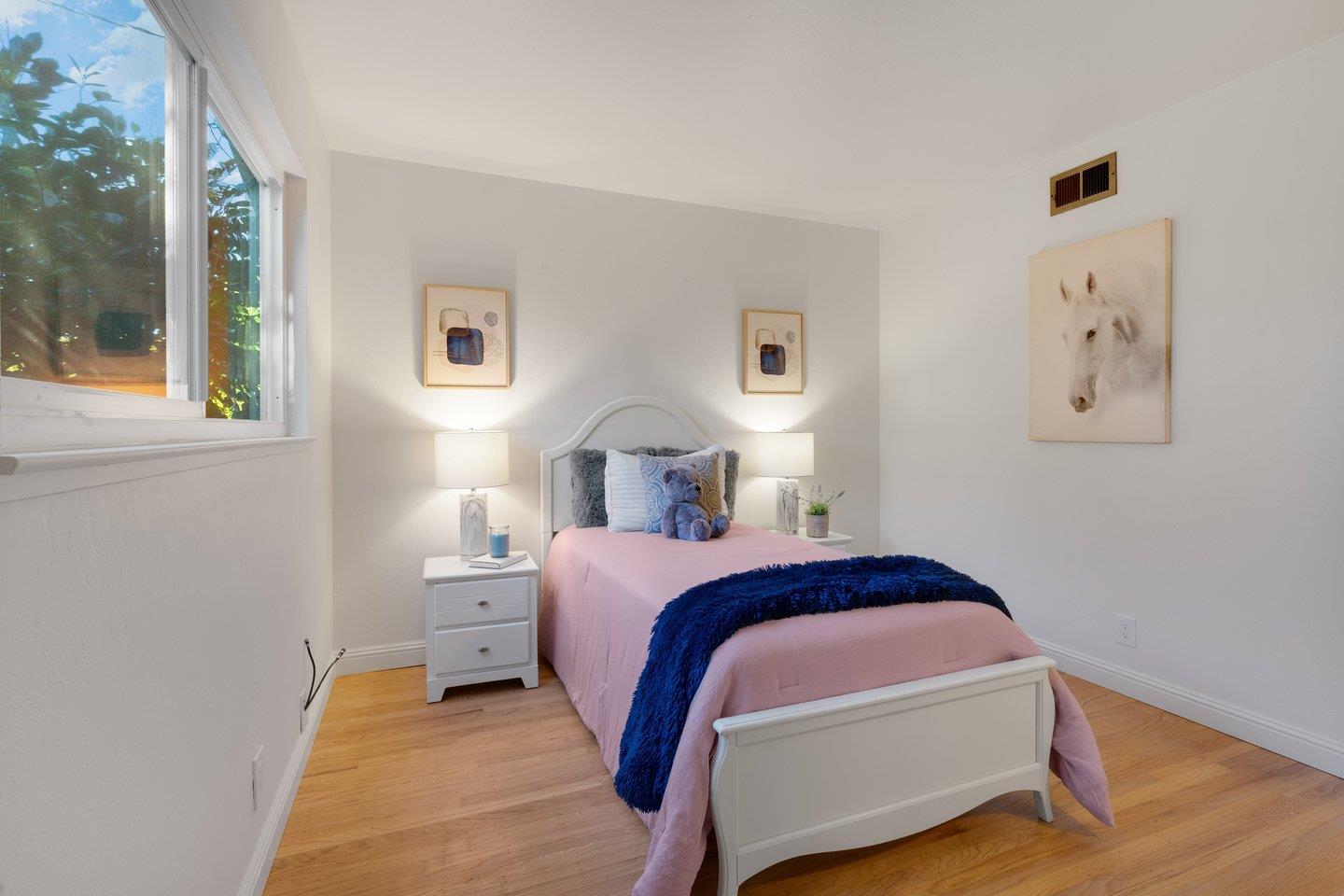 7457 Rollingdell Drive Cupertino, CA 95014 - Photo 20 of 33 a bedroom with a bed and a window