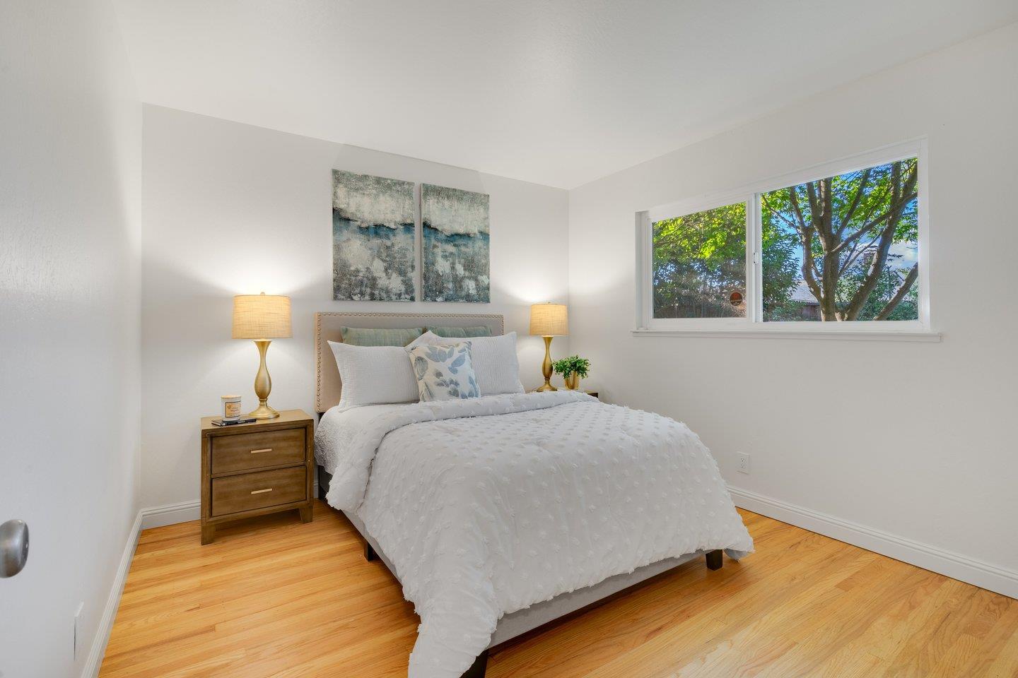 7457 Rollingdell Drive Cupertino, CA 95014 - Photo 22 of 33 a bedroom with a bed and a window