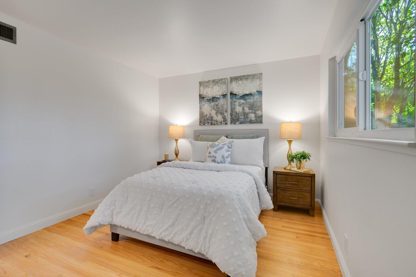 7457 Rollingdell Drive Cupertino, CA 95014 - Photo 23 of 33 a bedroom with a bed and a window