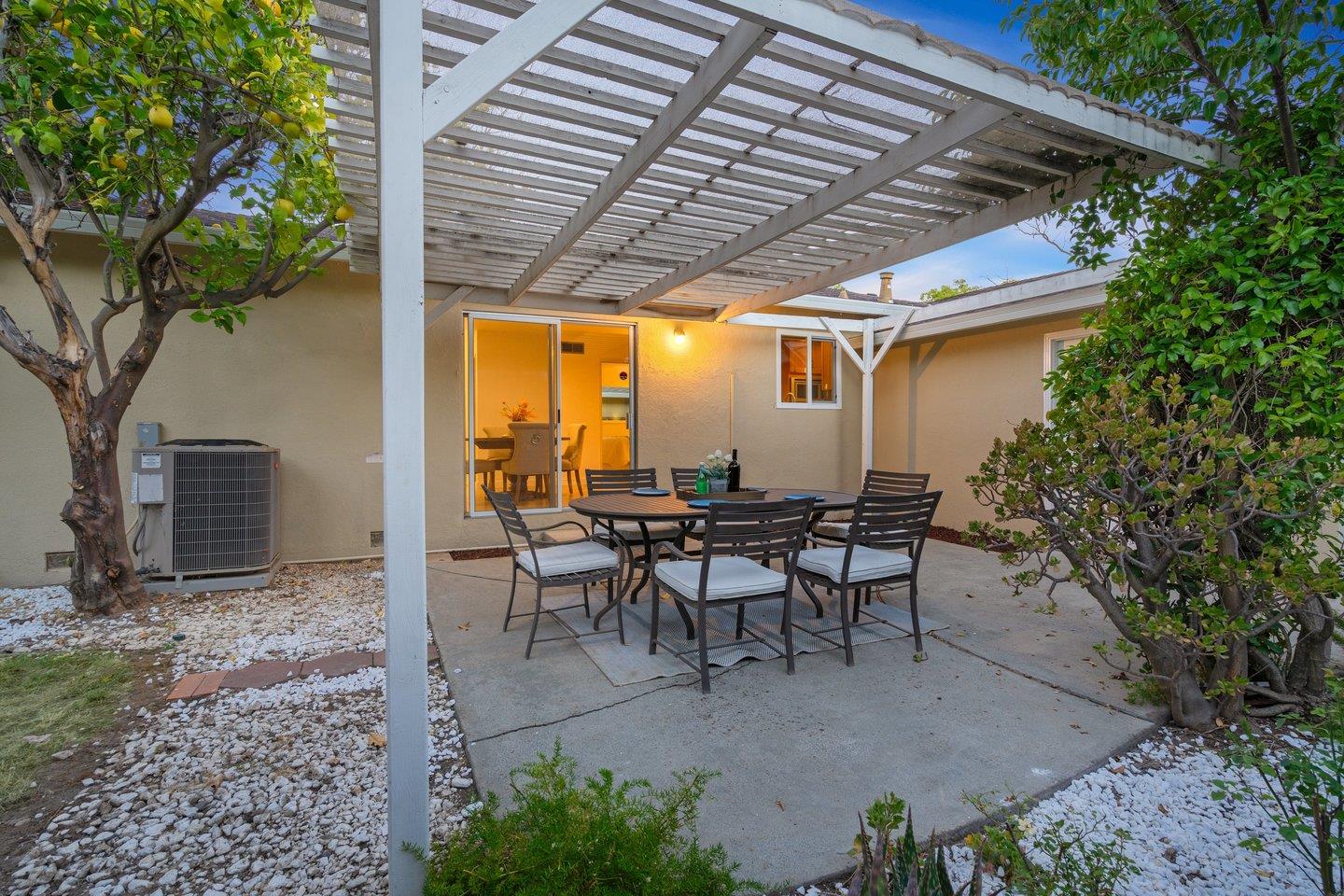 7457 Rollingdell Drive Cupertino, CA 95014 - Photo 26 of 33 a view of a patio with table and chairs and potted plants