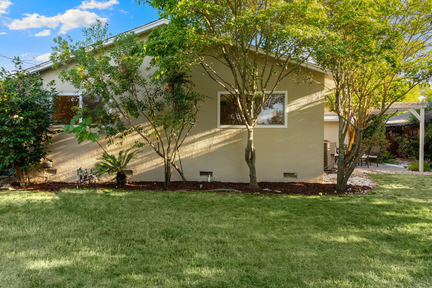 7457 Rollingdell Drive Cupertino, CA 95014 - Photo 30 of 33 a white house that has a tree in front of it