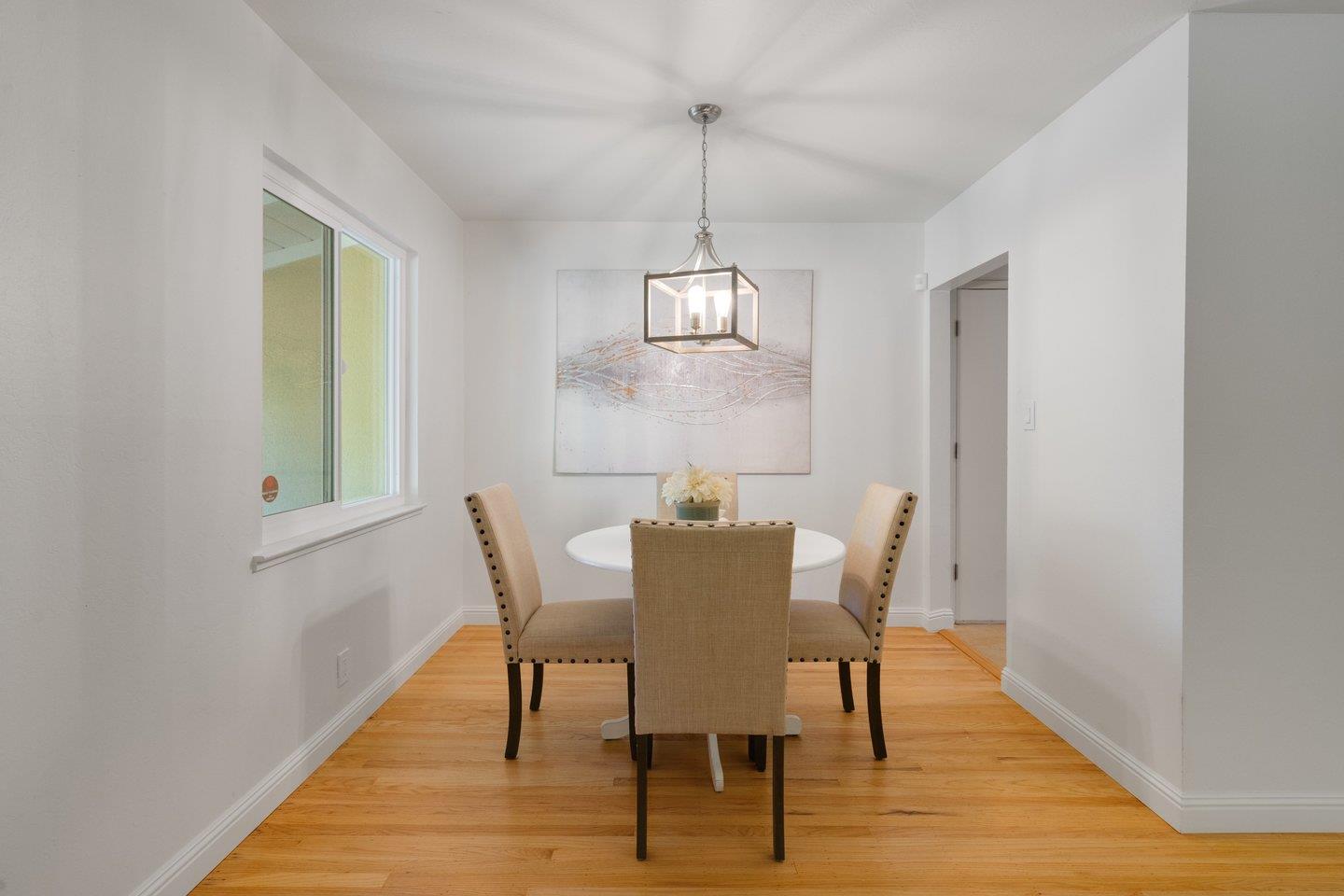 7457 Rollingdell Drive Cupertino, CA 95014 - Photo 10 of 33 a view of a dining room with furniture window and wooden floor