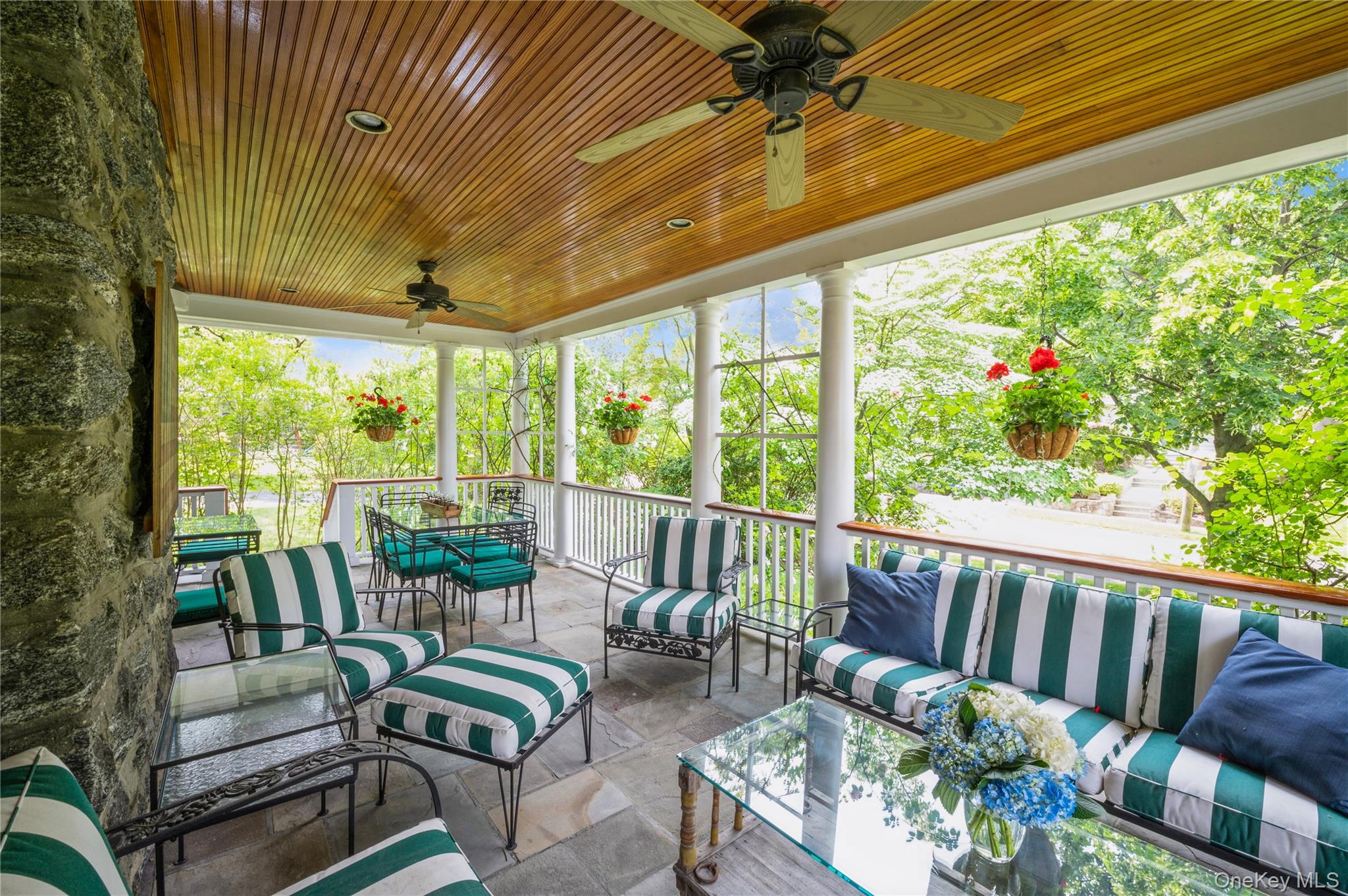 31 Emerson Road Larchmont, NY 10538 - Photo 14 of 39 Everyone LOVES this porch and you will too! Ceiling fans for warm summer nights, climbing roses, beautiful wood ceiling and stone floors...it is definitely a showstopper space!
