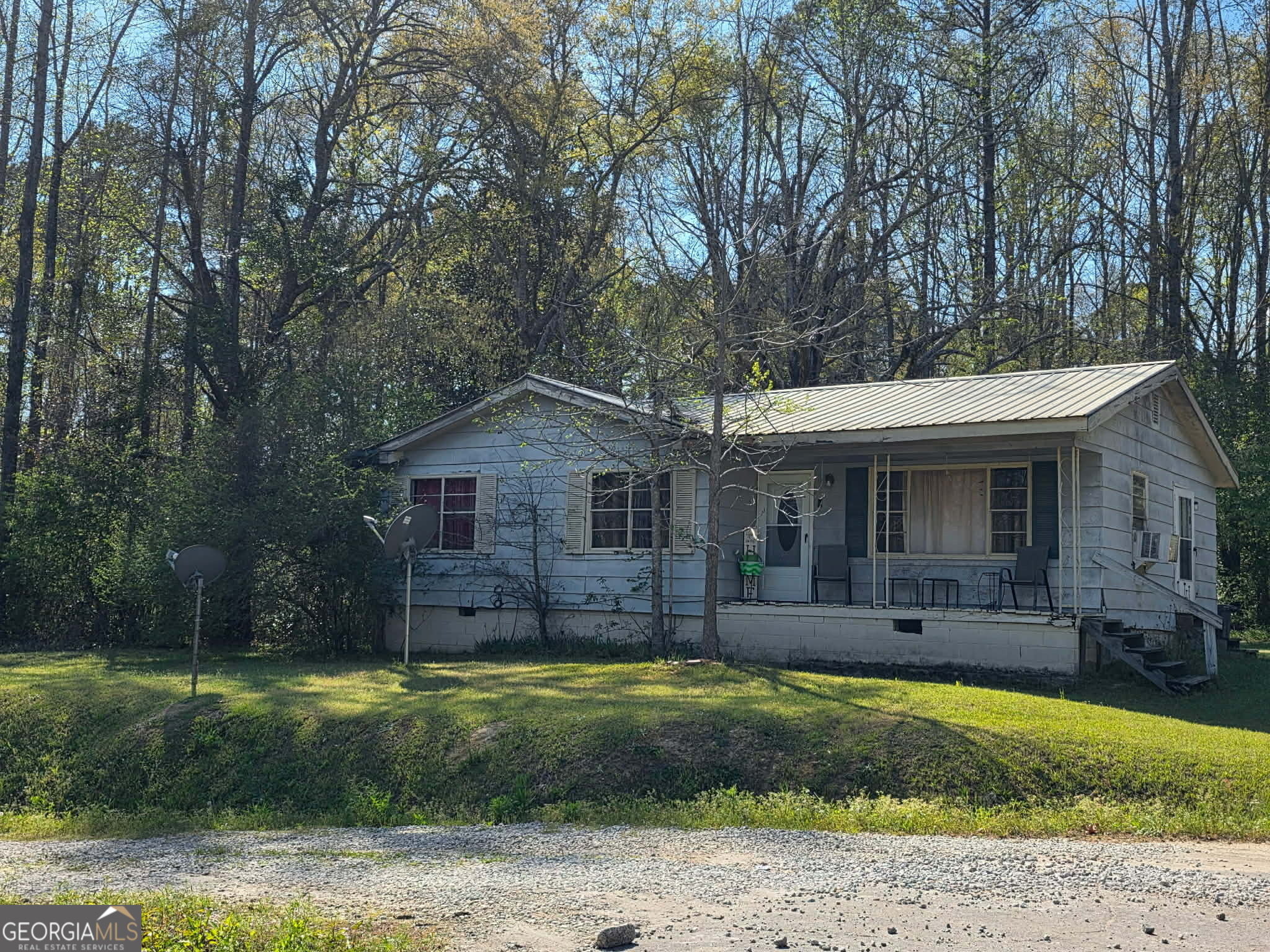 1 Silver Street Warm Springs, GA 31830 - Photo 2 of 5 a front view of a house with a yard