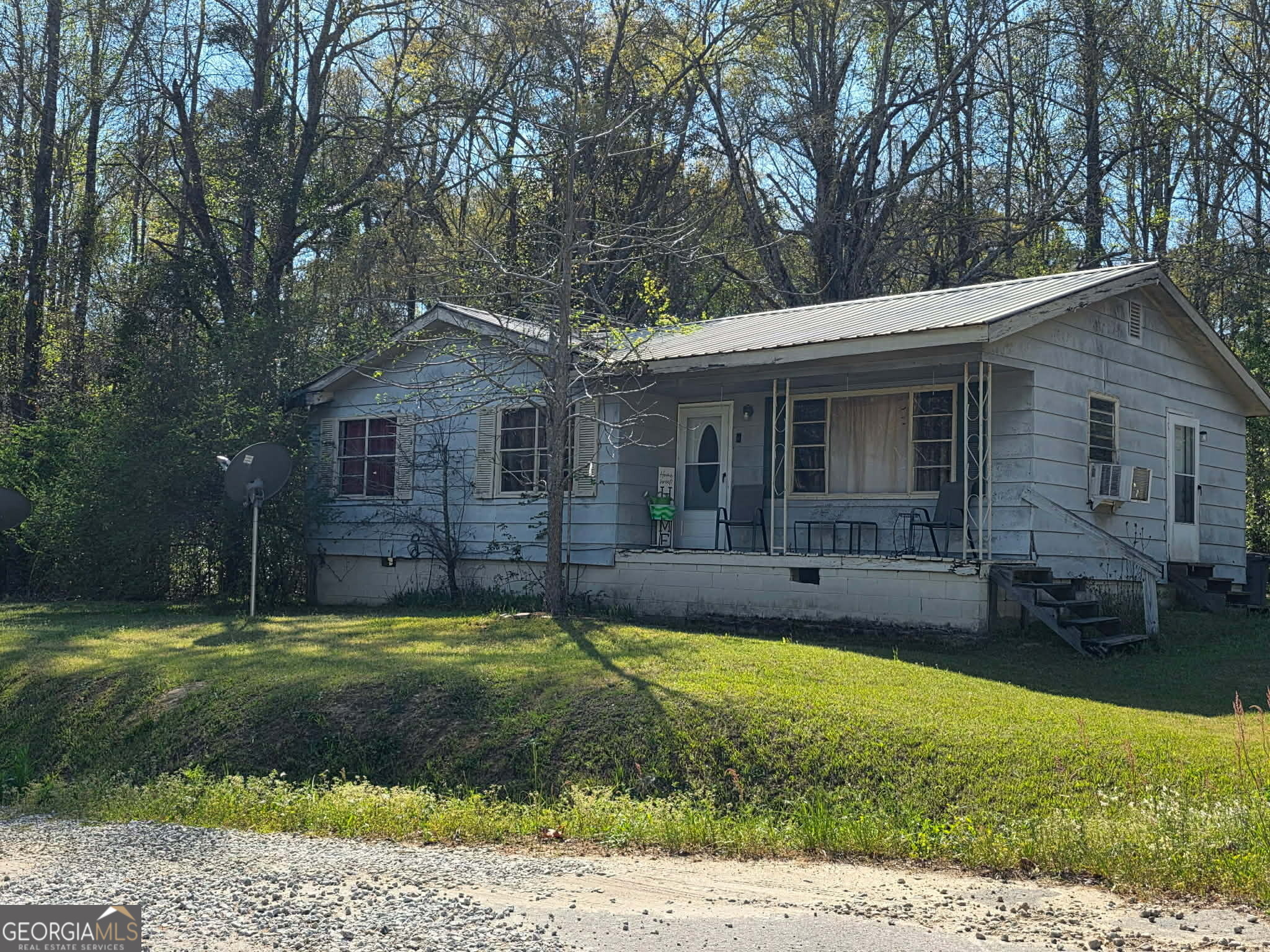 1 Silver Street Warm Springs, GA 31830 - Photo 4 of 5 a view of a house with a patio and a yard