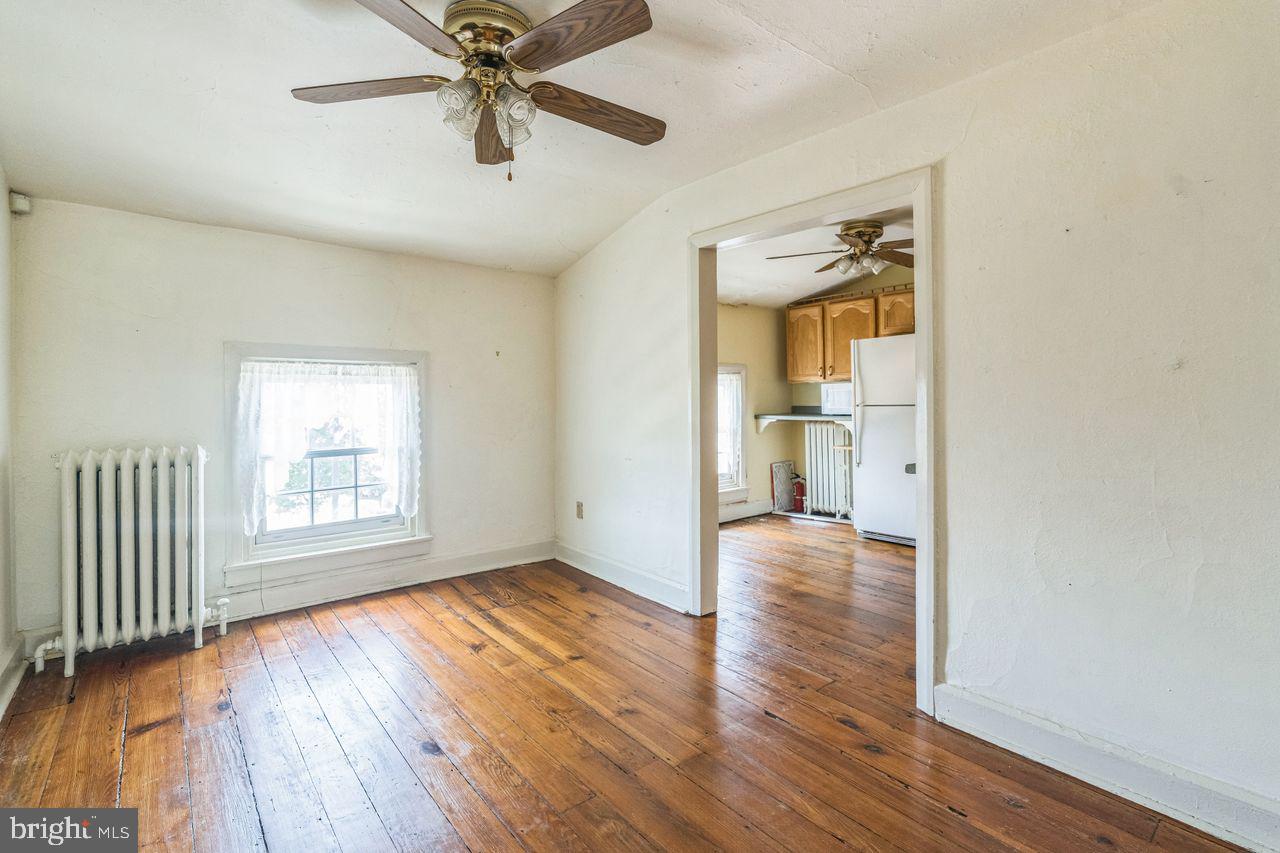 349 West State Street, Unit 3 Media, PA 19063 - Photo 3 of 8 a view of a livingroom with wooden floor and a ceiling fan