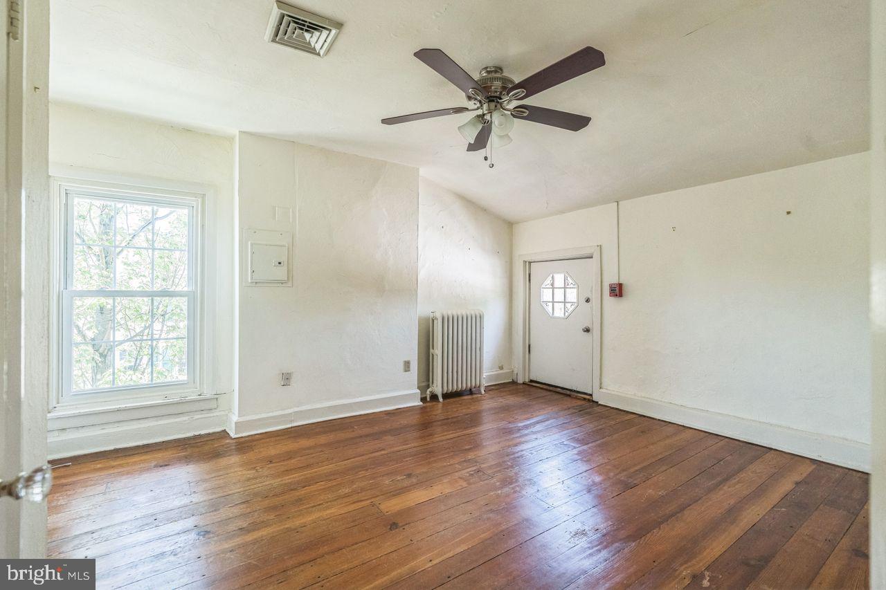 349 West State Street, Unit 3 Media, PA 19063 - Photo 4 of 8 a view of a big room with wooden floor and windows