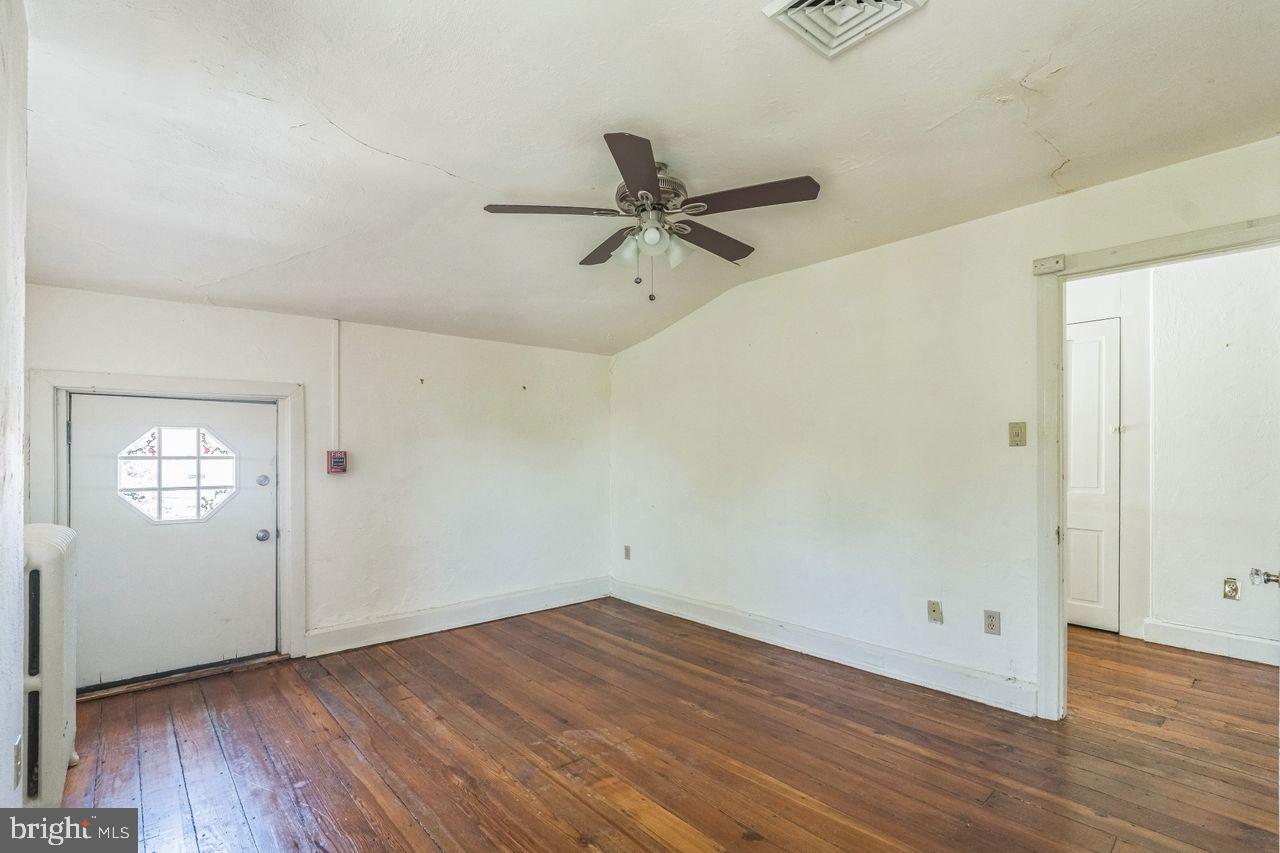 349 West State Street, Unit 3 Media, PA 19063 - Photo 5 of 8 an empty room with wooden floor and windows