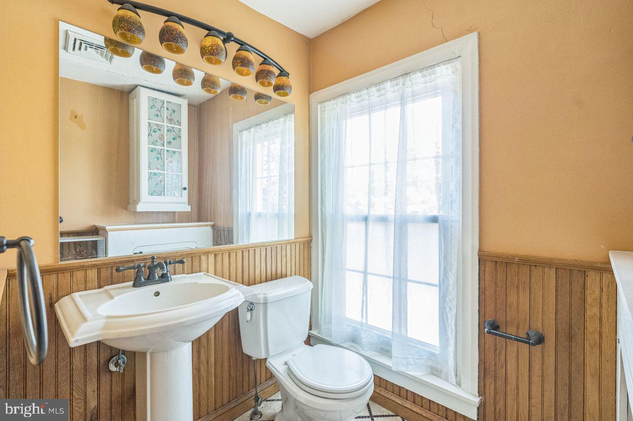 349 West State Street, Unit 3 Media, PA 19063 - Photo 7 of 8 a bathroom with a sink a toilet and shower