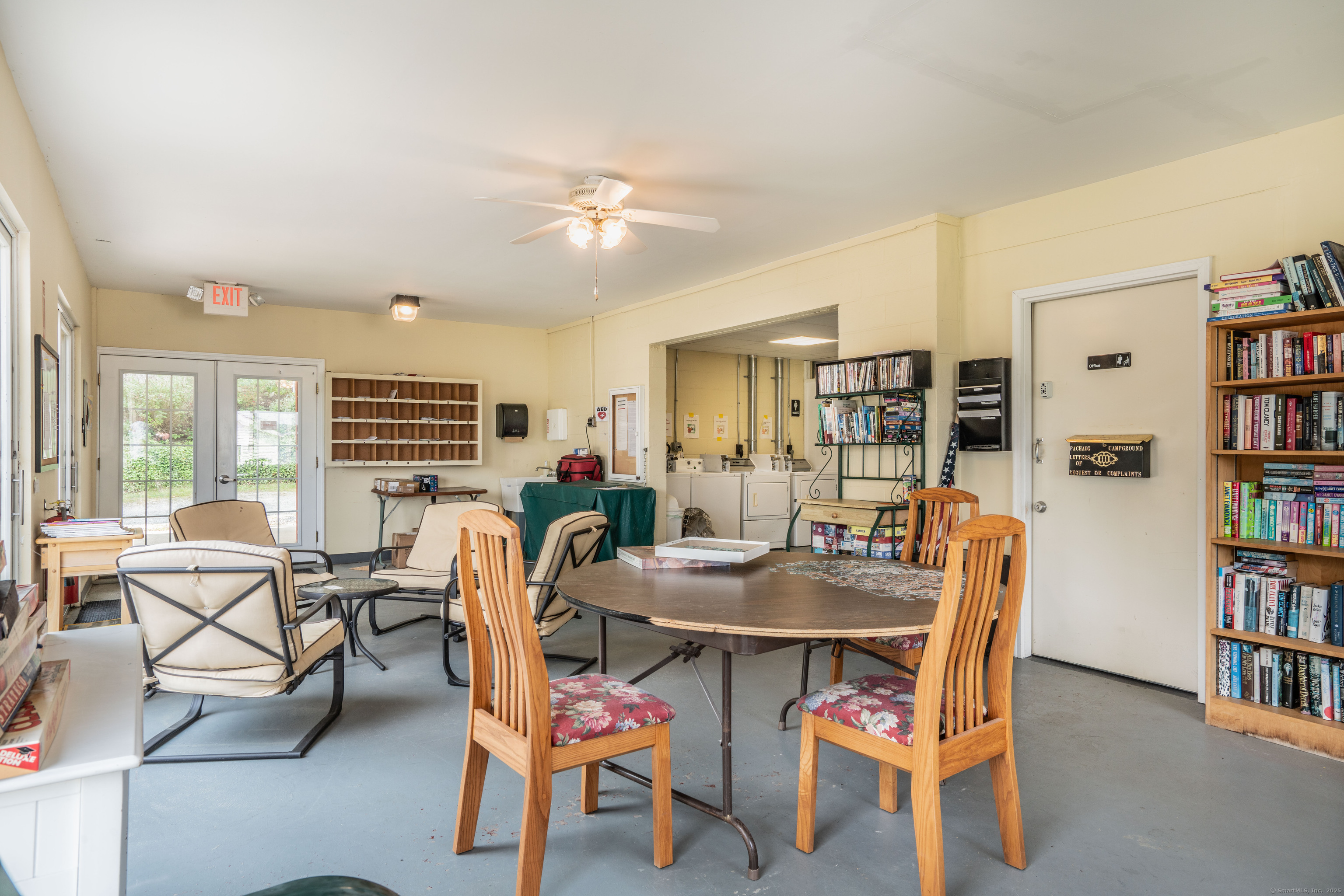 262 Shetucket Turnpike, Unit 2 Griswold, CT 06351 - Photo 8 of 26 a dining room with furniture and wooden floor