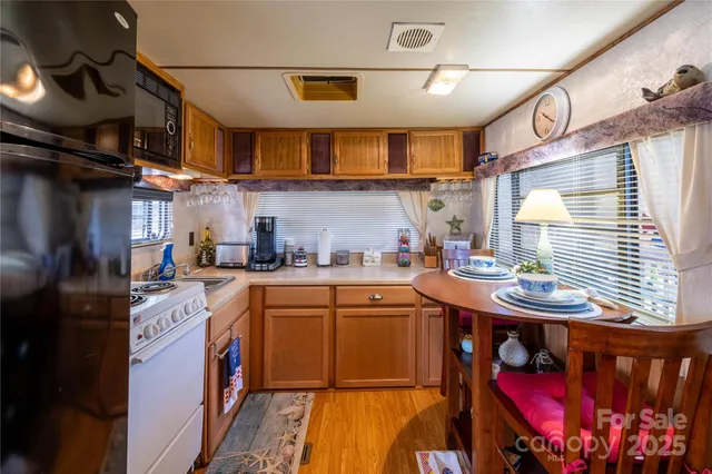 a bathroom with a sink and mirror with bathtub