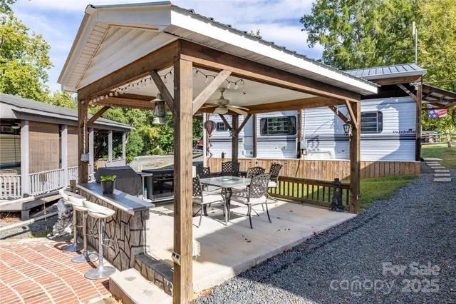 a view of a chair and tables in the patio