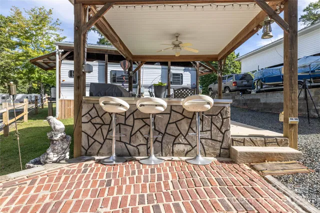 a view of a patio with a table and chairs