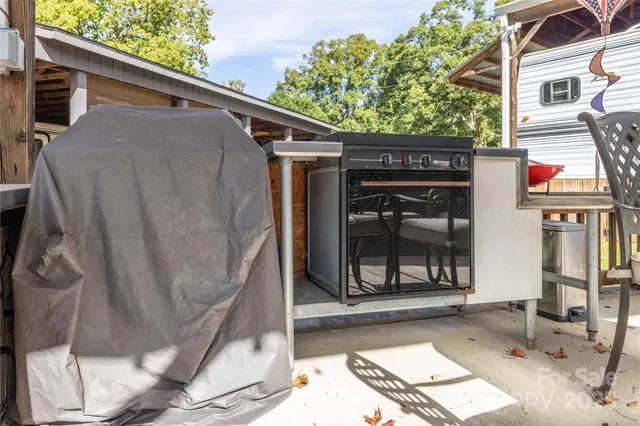 an aerial view of a house with a yard and lake view
