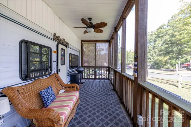 a chair and table in a balcony