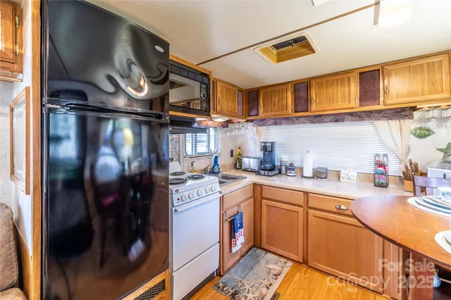 a view of a chairs and table on the deck