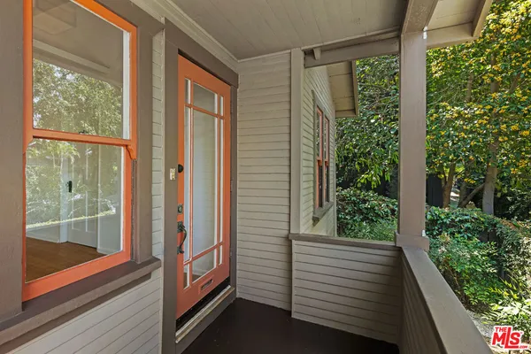 a view of a glass door with a balcony