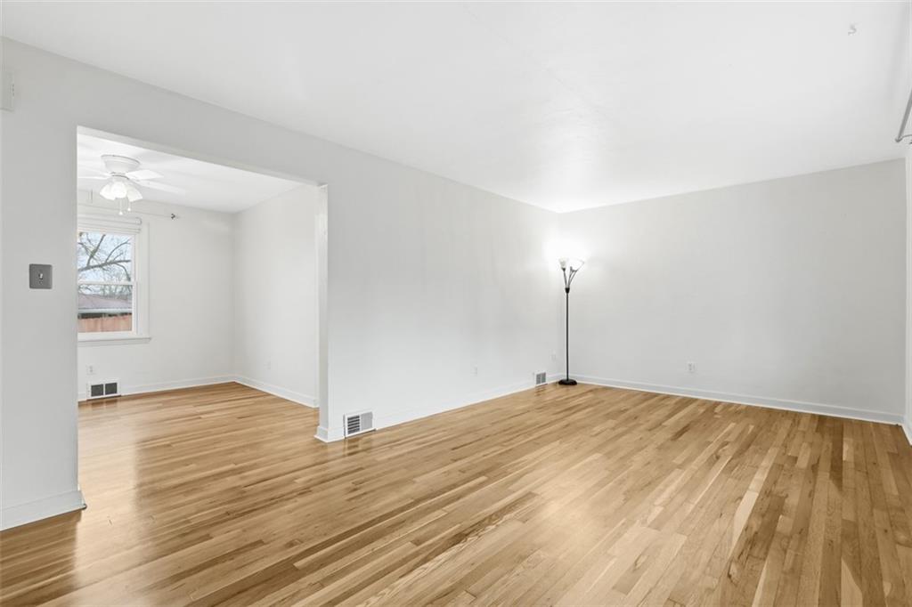 513 Lombard Street Irwin, PA 15642 - Photo 7 of 31 a view of a room with wooden floor and white walls