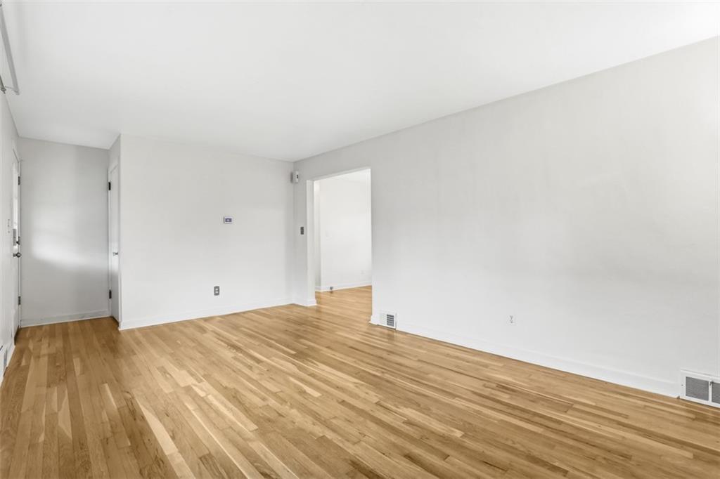 513 Lombard Street Irwin, PA 15642 - Photo 9 of 31 a view of empty room with wooden floor
