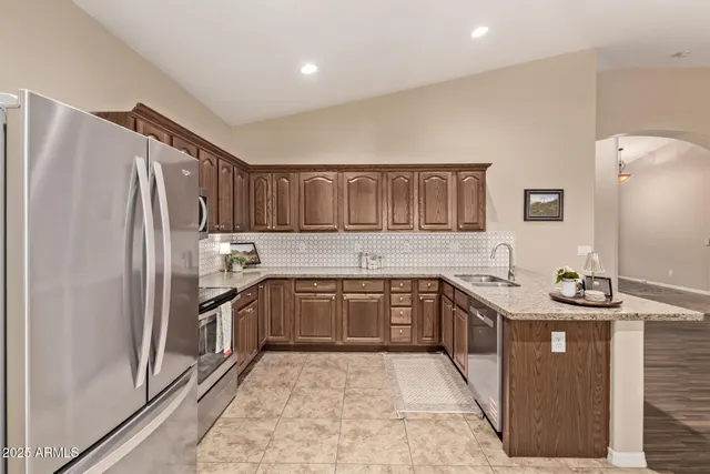 a view of a hallway with closet and a window