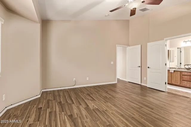 a bathroom with a granite countertop sink a large mirror and vanity