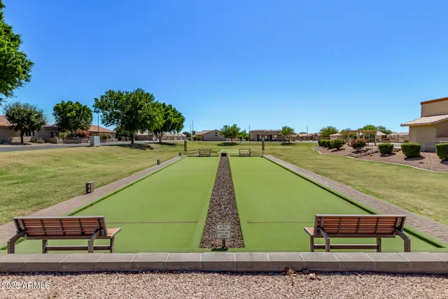 a view of a swimming pool with an outdoor space and seating area