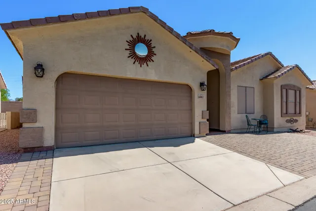 a front view of a house with a garage
