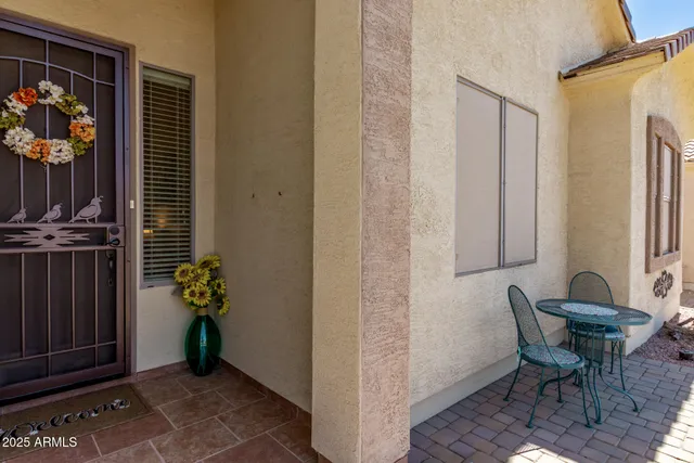 a view of room with patio and dining area