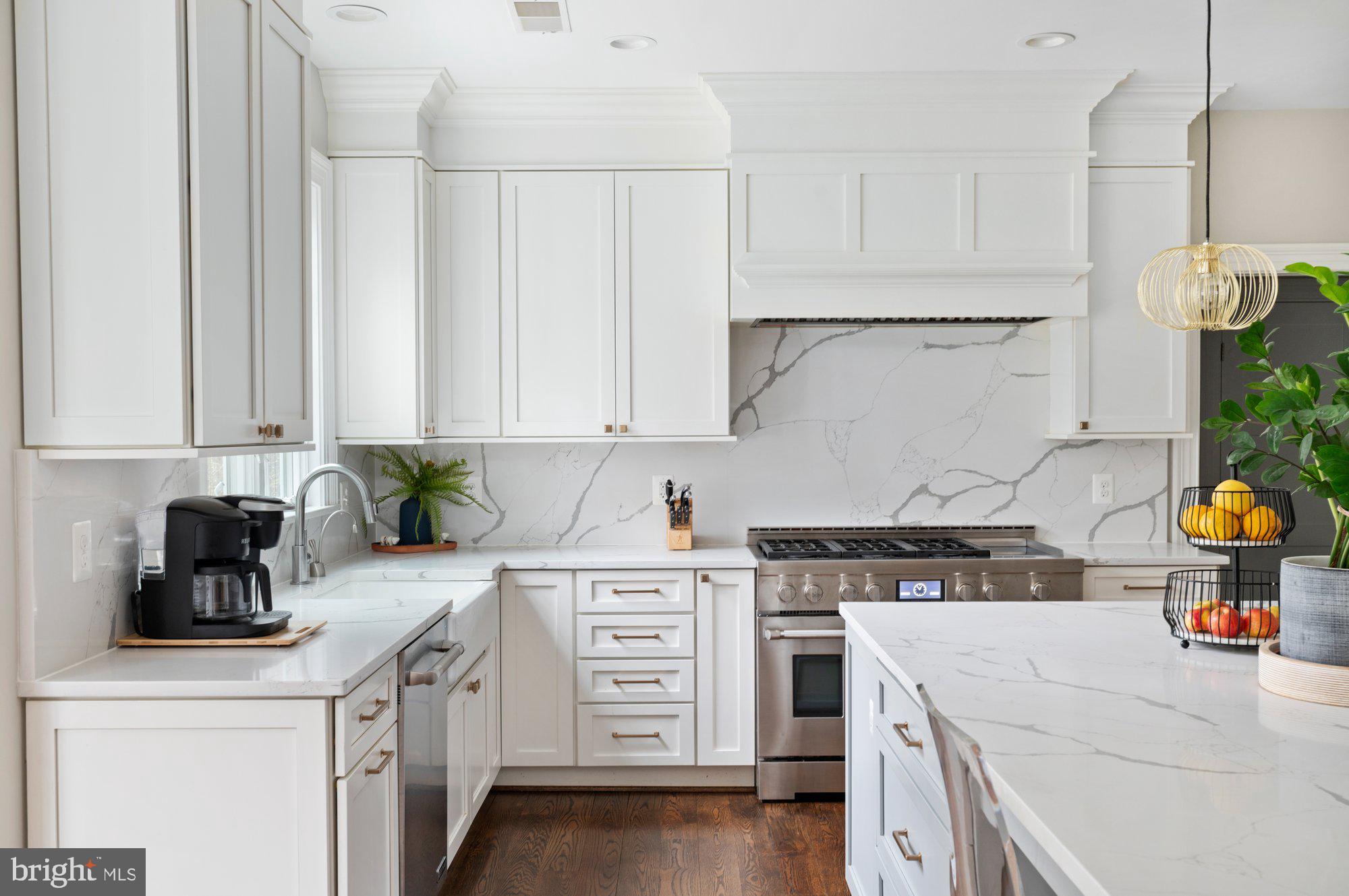 1610 Brookside Road McLean, VA 22101 - Photo 14 of 51 a kitchen with stainless steel appliances a stove a white cabinets and a sink
