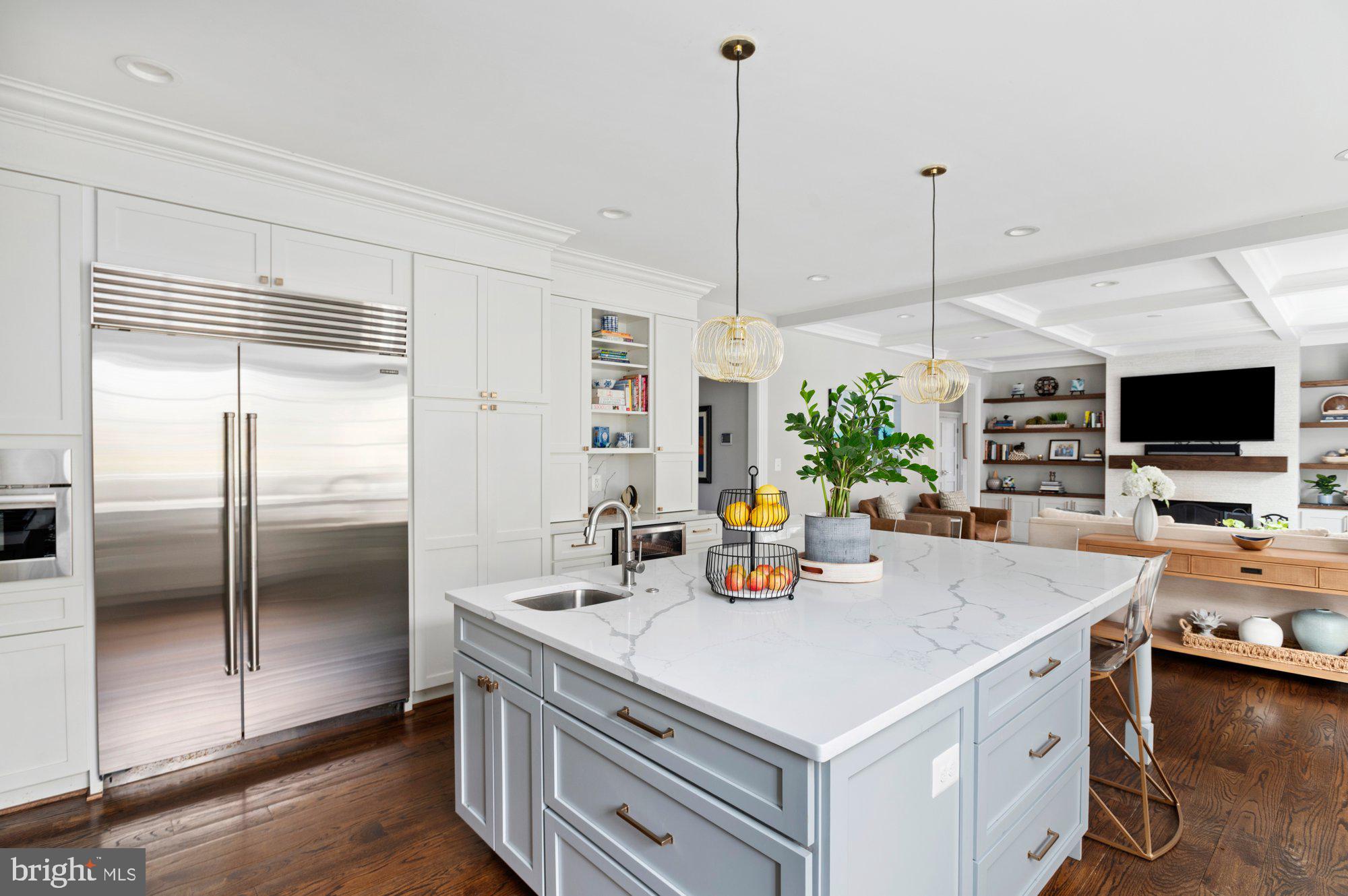 1610 Brookside Road McLean, VA 22101 - Photo 15 of 51 a kitchen with stainless steel appliances a sink a refrigerator a stove a microwave a dining table and chairs