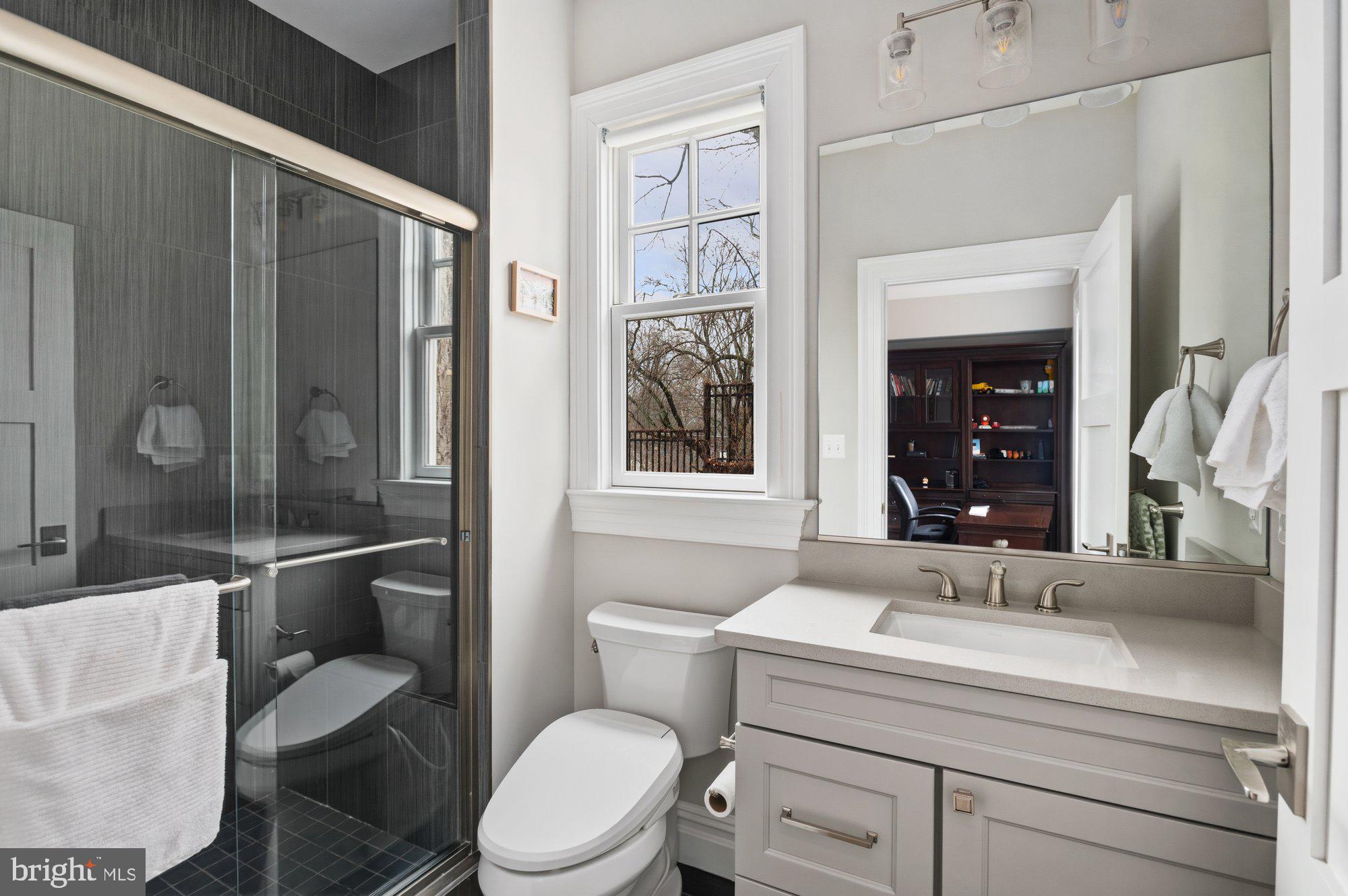 1610 Brookside Road McLean, VA 22101 - Photo 20 of 51 a bathroom with a sink toilet and shower