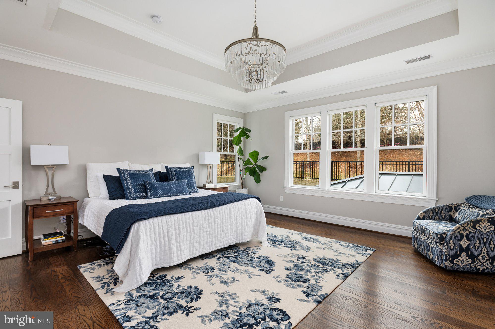 1610 Brookside Road McLean, VA 22101 - Photo 22 of 51 a spacious bedroom with a bed and wooden floor