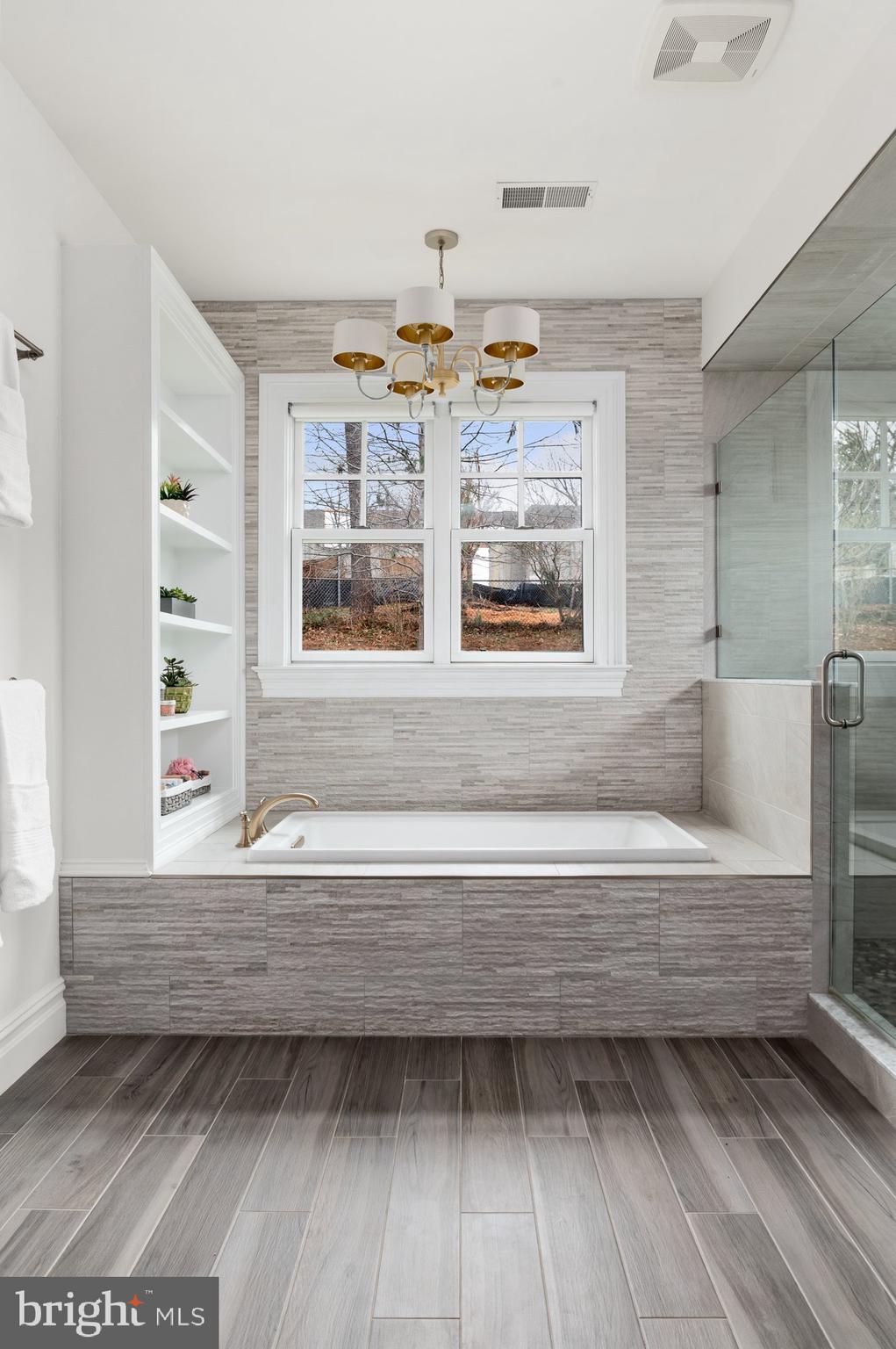 1610 Brookside Road McLean, VA 22101 - Photo 24 of 51 a bathroom with a bathtub and a window