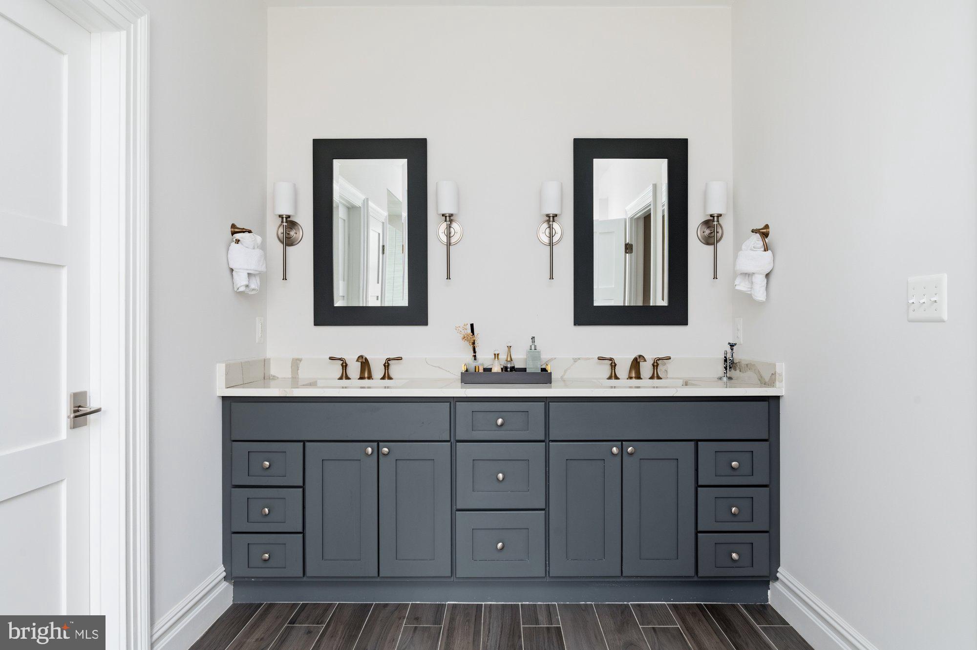 1610 Brookside Road McLean, VA 22101 - Photo 25 of 51 a bathroom with a sink and a mirror