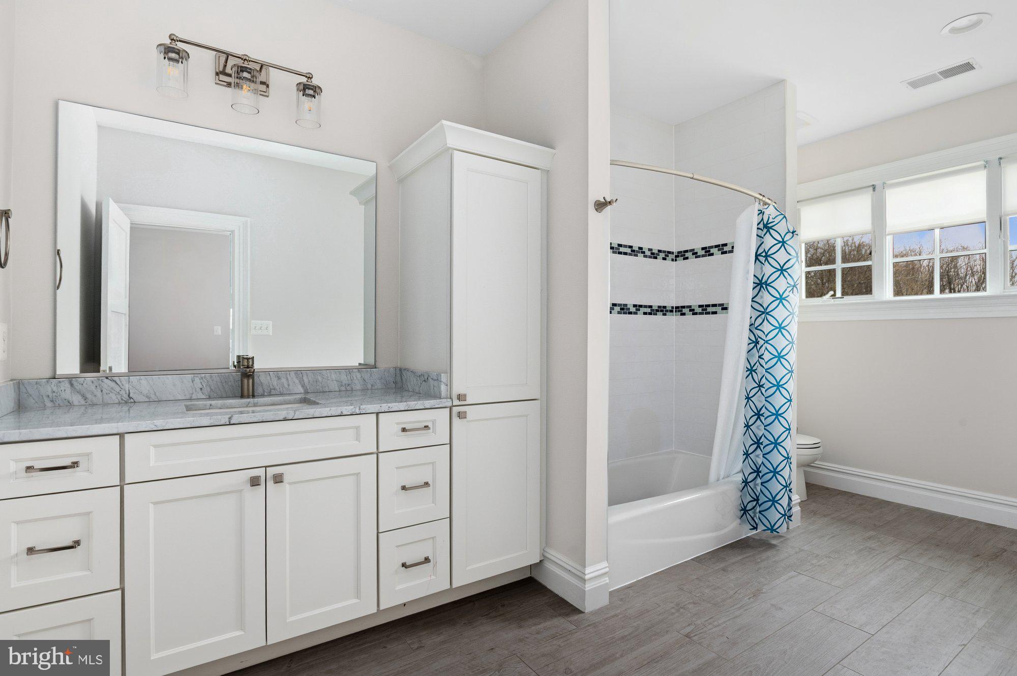 1610 Brookside Road McLean, VA 22101 - Photo 29 of 51 a bathroom with a granite countertop sink and a mirror