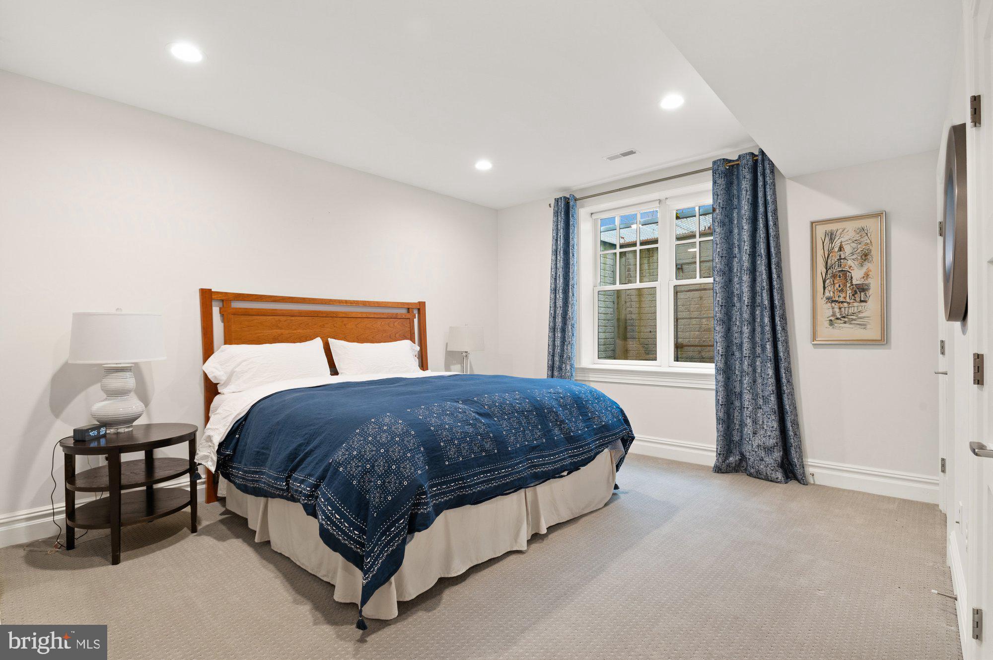 1610 Brookside Road McLean, VA 22101 - Photo 39 of 51 a bedroom with a large bed and a window