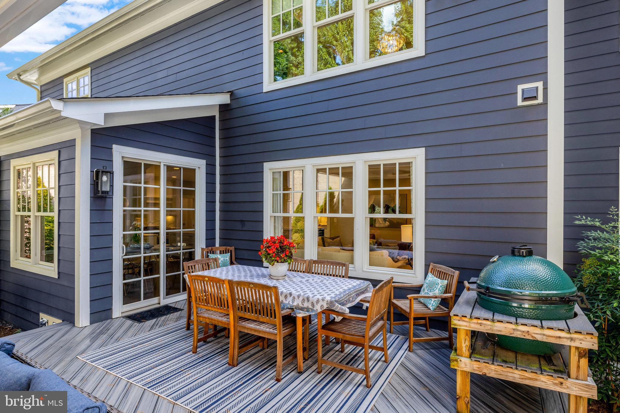 1610 Brookside Road McLean, VA 22101 - Photo 44 of 51 a view of a patio with table and chairs with wooden floor and fence