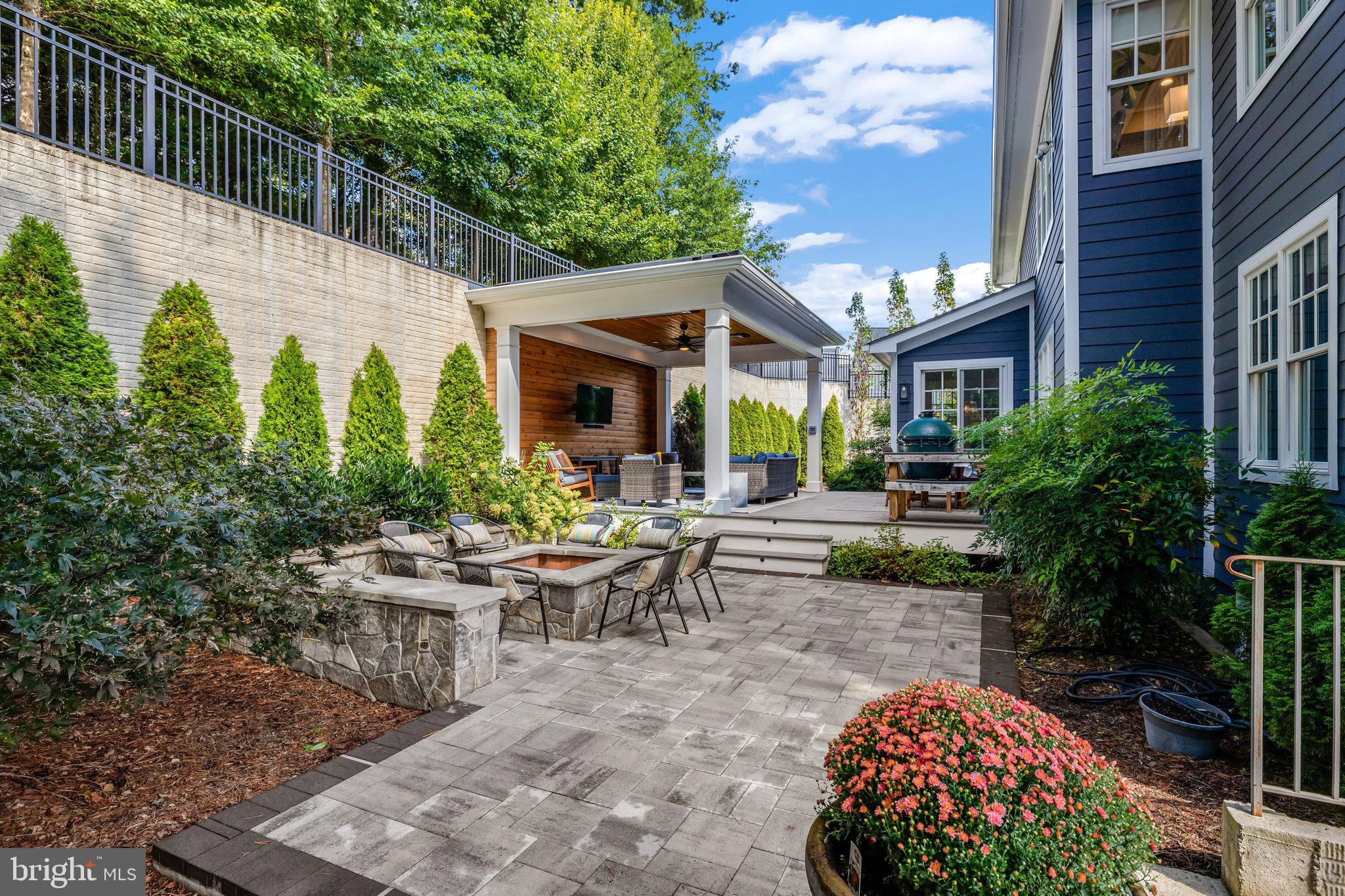 1610 Brookside Road McLean, VA 22101 - Photo 45 of 51 a view of a patio with couches and table and chairs and potted plants